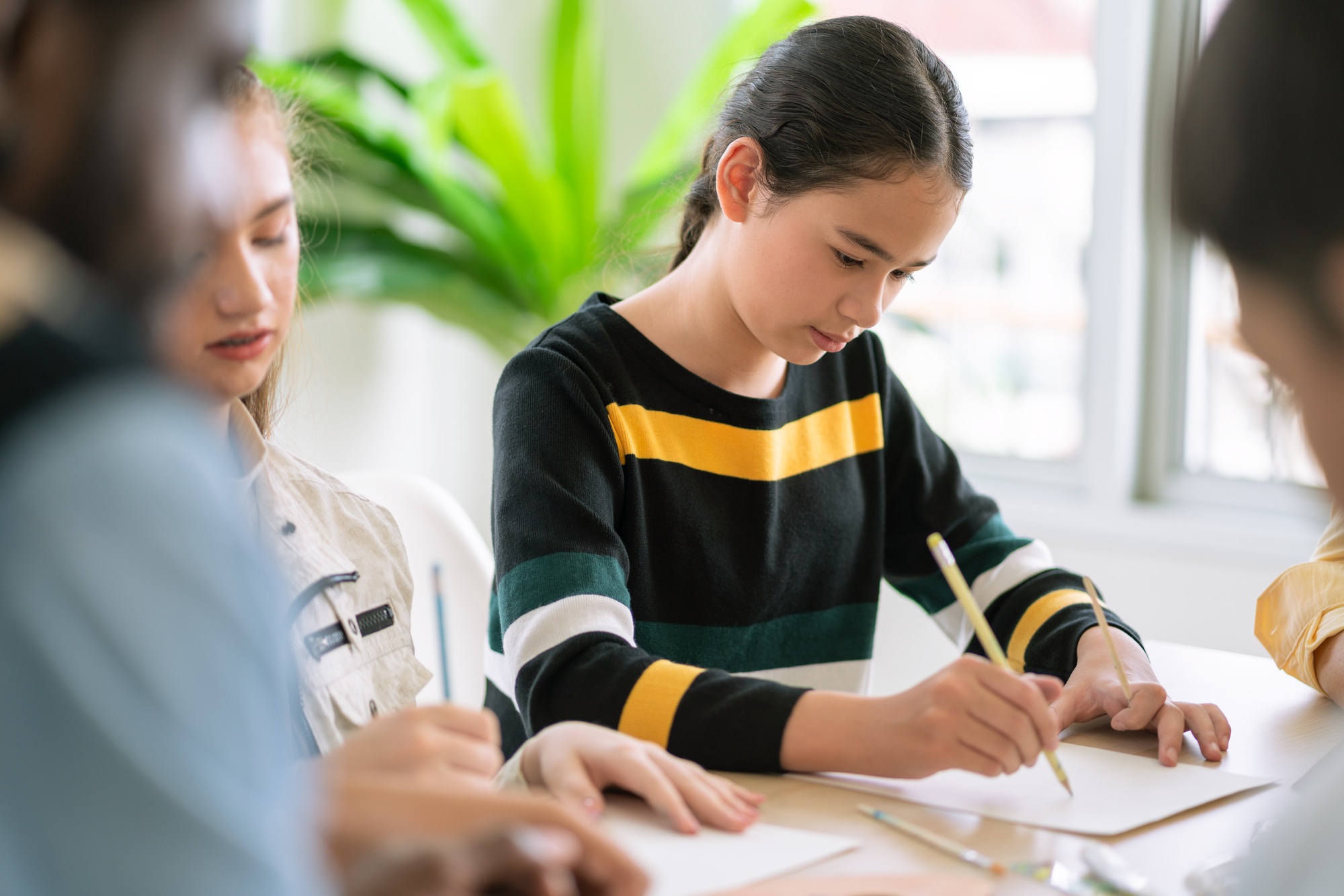 Girl enjoy drawing and painting in arts class