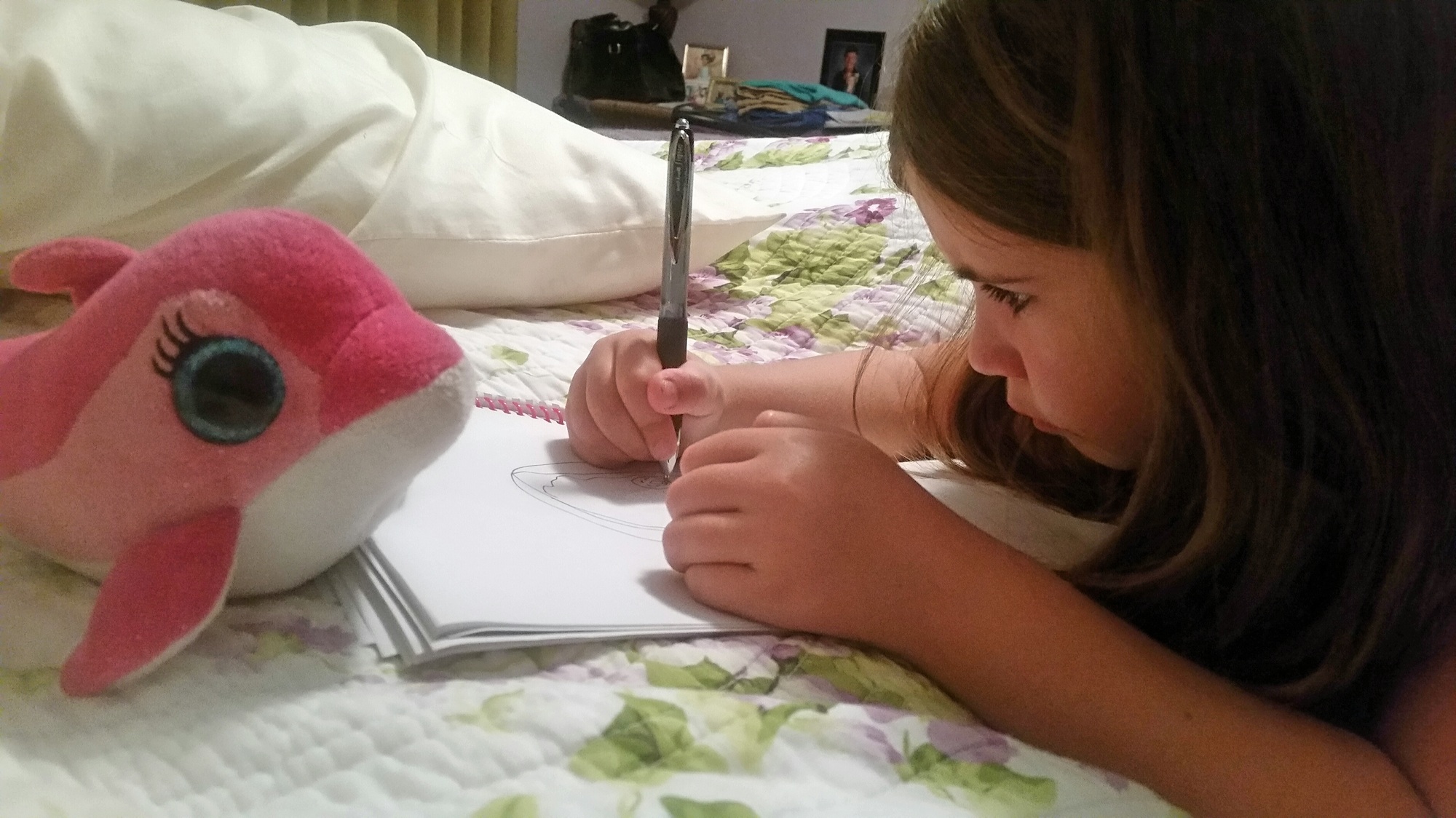 Little girl drawing a pink fish...very fishy...