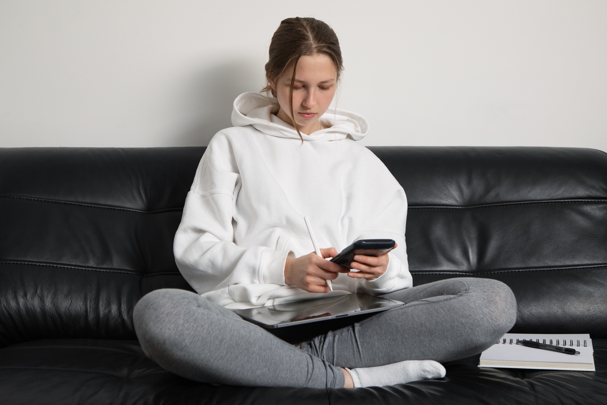 Teenage girl doing math on a calculator