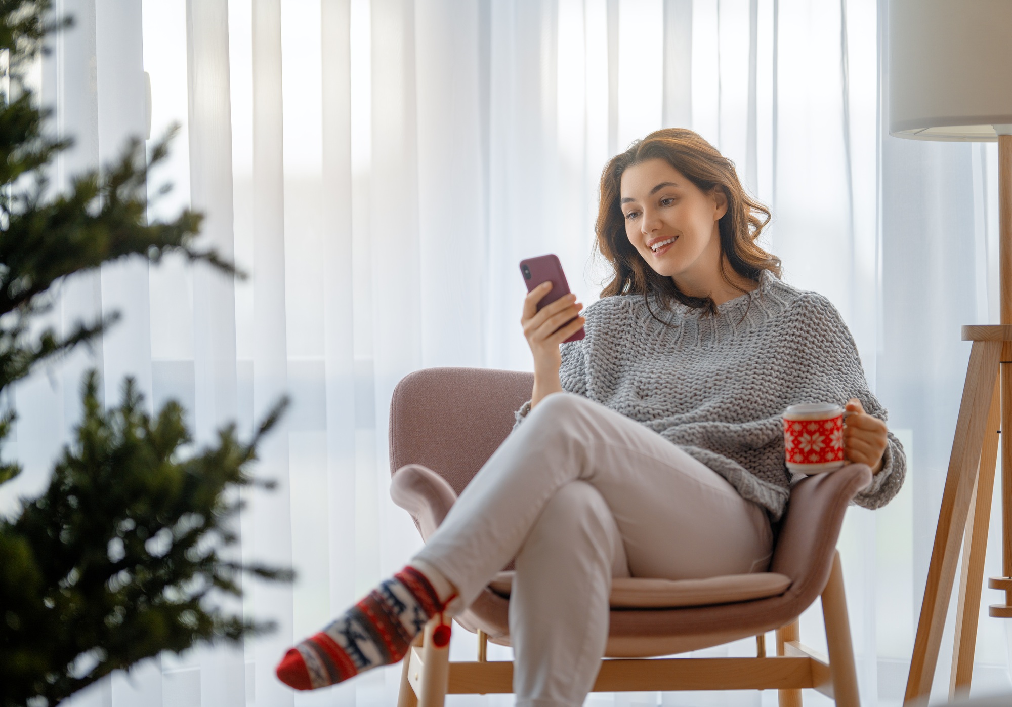 woman near Christmas tree
